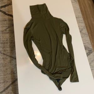 Green turtleneck body suit